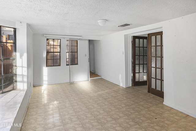 4008 Tularosa Ave, El Paso, TX 79903 - empty room featuring a textured ceiling and tile patterned floors