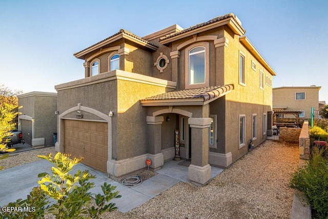 5004 Gold Ranch Ave, El Paso, TX 79934 - mediterranean / spanish-style house with a garage, a tile roof, and stucco siding