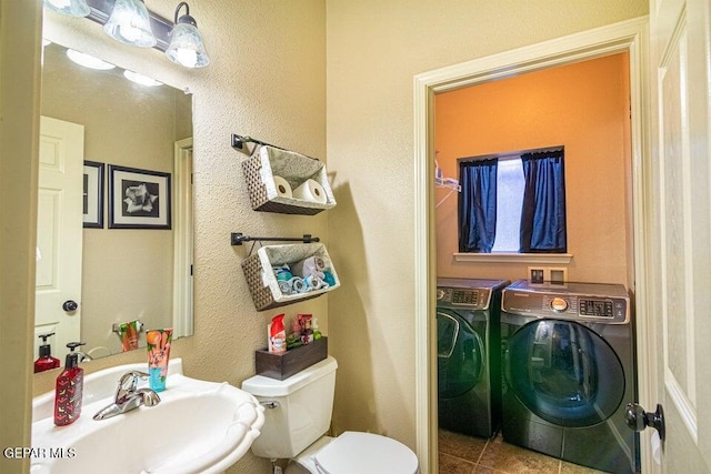 5004 Gold Ranch Ave, El Paso, TX 79934 - half bath with washing machine and clothes dryer, tile patterned floors, and a textured wall