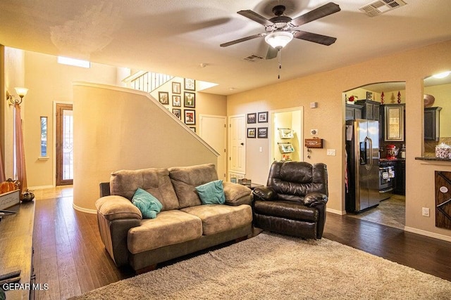 5004 Gold Ranch Ave, El Paso, TX 79934 - living room with dark wood finished floors, stairway, and ceiling fan