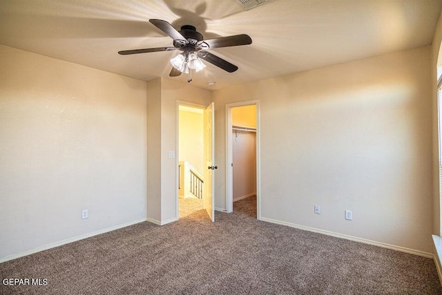 5004 Gold Ranch Ave, El Paso, TX 79934 - unfurnished bedroom featuring carpet floors, a walk in closet, a ceiling fan, and a closet