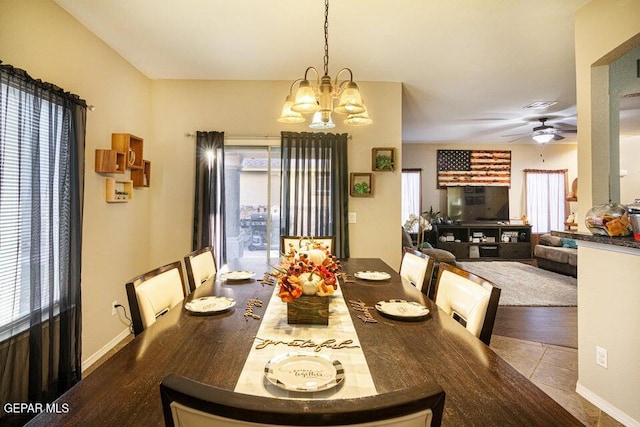 5004 Gold Ranch Ave, El Paso, TX 79934 - dining room with a chandelier, a ceiling fan, and tile patterned floors