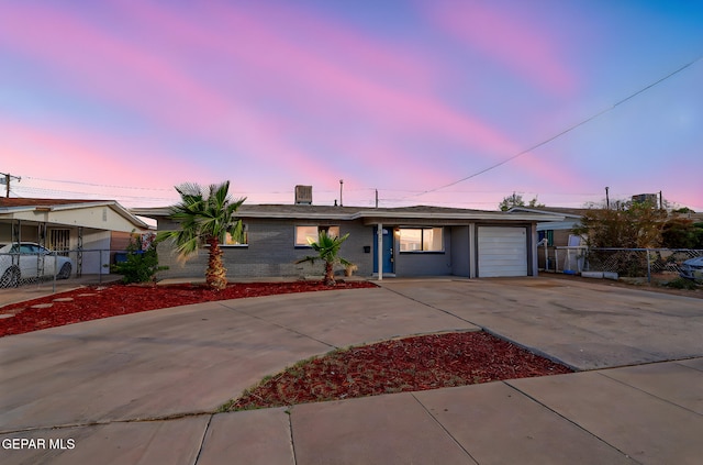 4956 Rutherford Dr, El Paso, TX 79924 - single story home featuring concrete driveway and an attached garage