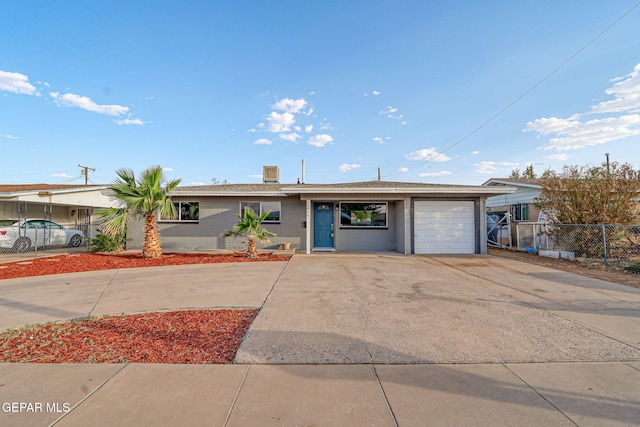 4956 Rutherford Dr, El Paso, TX 79924 - single story home with an attached garage, concrete driveway, and brick siding