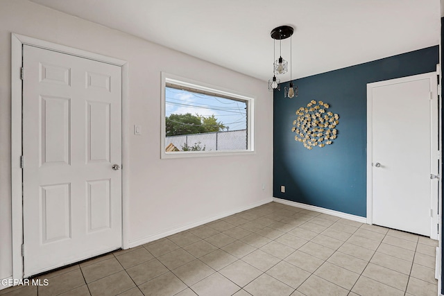 4956 Rutherford Dr, El Paso, TX 79924 - empty room with light tile patterned floors and baseboards