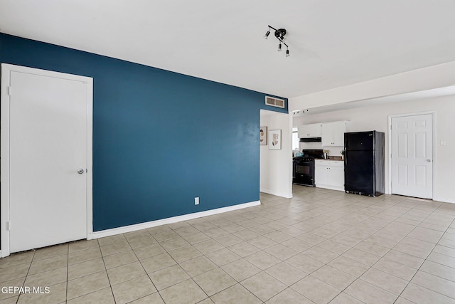 4956 Rutherford Dr, El Paso, TX 79924 - unfurnished living room featuring light tile patterned floors and baseboards