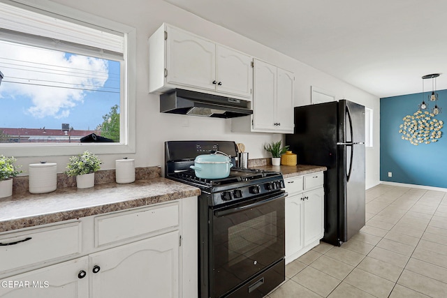 4956 Rutherford Dr, El Paso, TX 79924 - kitchen with black appliances, under cabinet range hood, white cabinets, light tile patterned flooring, and decorative light fixtures