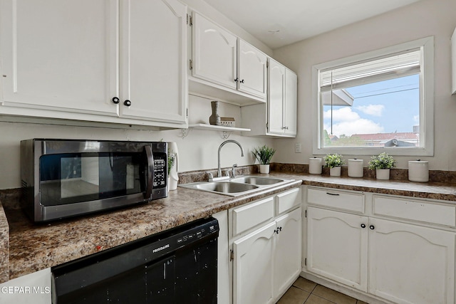 4956 Rutherford Dr, El Paso, TX 79924 - kitchen with dishwasher, stainless steel microwave, white cabinets, open shelves, and light tile patterned flooring