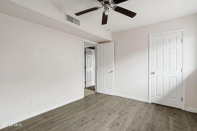 4956 Rutherford Dr, El Paso, TX 79924 - unfurnished bedroom with wood finished floors and a ceiling fan