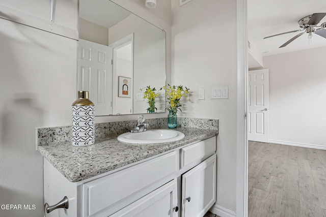 4956 Rutherford Dr, El Paso, TX 79924 - bathroom featuring ceiling fan, vanity, and wood finished floors
