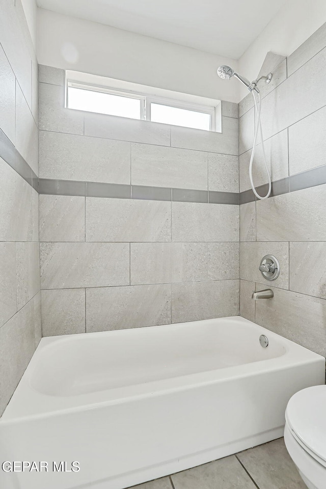 4956 Rutherford Dr, El Paso, TX 79924 - bathroom with washtub / shower combination and tile patterned flooring