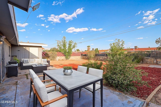 4956 Rutherford Dr, El Paso, TX 79924 - fenced backyard featuring outdoor lounge area, a patio, and outdoor dining space