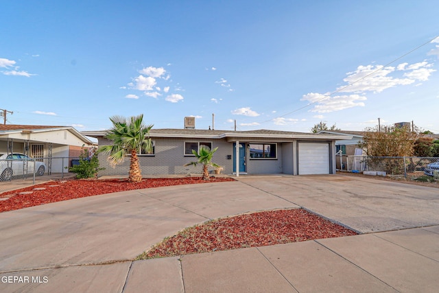 4956 Rutherford Dr, El Paso, TX 79924 - ranch-style home with driveway, an attached garage, and brick siding