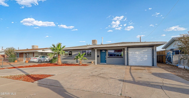 4956 Rutherford Dr, El Paso, TX 79924 - single story home featuring driveway, an attached garage, and brick siding