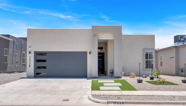 12328 Desert Heights Ct, El Paso, TX 79938 - modern home with stucco siding, driveway, and a garage