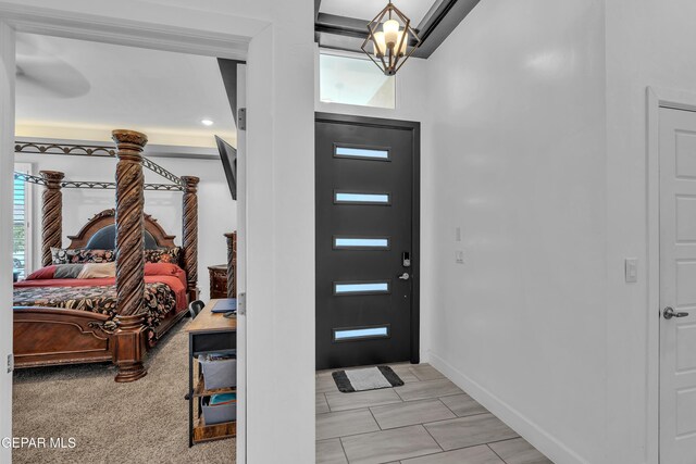 12328 Desert Heights Ct, El Paso, TX 79938 - foyer entrance with baseboards and a chandelier