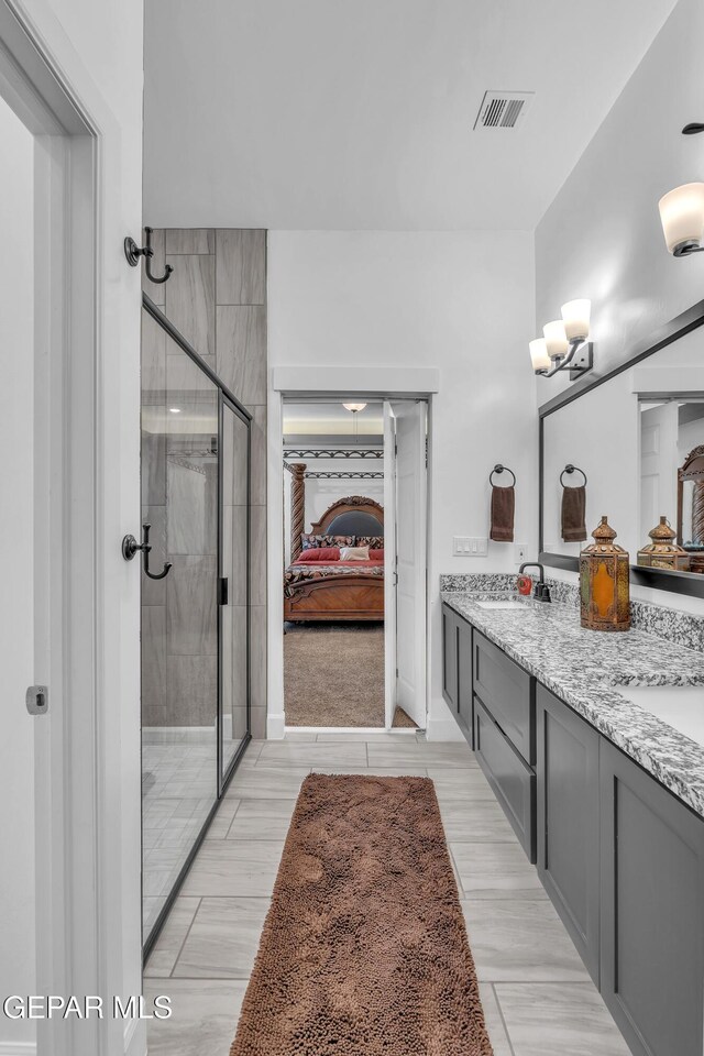 12328 Desert Heights Ct, El Paso, TX 79938 - ensuite bathroom with double vanity and a shower stall