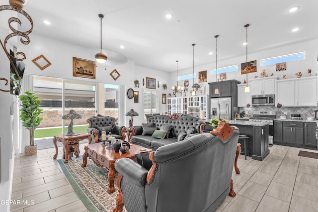 12328 Desert Heights Ct, El Paso, TX 79938 - living area with a towering ceiling, recessed lighting, and healthy amount of natural light