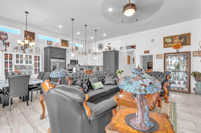 12328 Desert Heights Ct, El Paso, TX 79938 - living room featuring a chandelier, a ceiling fan, healthy amount of natural light, and recessed lighting