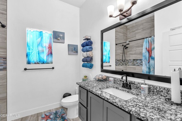 12328 Desert Heights Ct, El Paso, TX 79938 - full bathroom featuring vanity, a tile shower, a chandelier, and wood finished floors