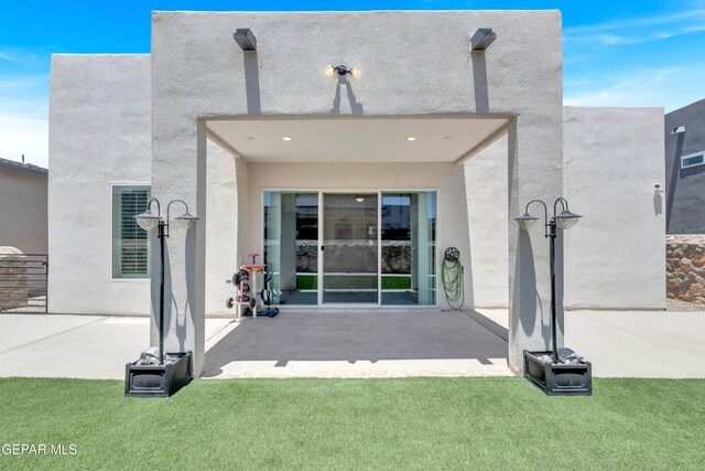 12328 Desert Heights Ct, El Paso, TX 79938 - rear view of house featuring stucco siding and a patio