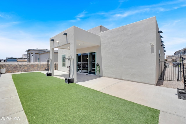 12328 Desert Heights Ct, El Paso, TX 79938 - back of house featuring a patio, stucco siding, and a gate