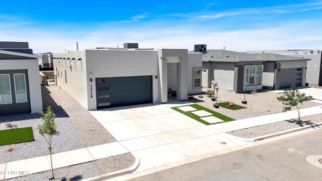 12328 Desert Heights Ct, El Paso, TX 79938 - view of front of home featuring an attached garage, stucco siding, and concrete driveway