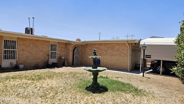 5028 Sagittarius Ave, El Paso, TX 79924 - rear view of property featuring brick siding