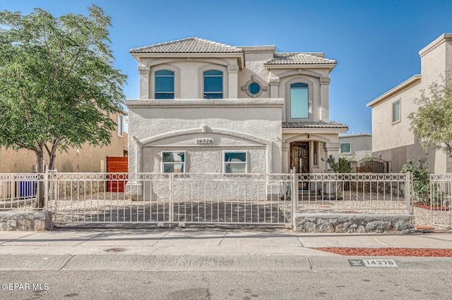 14376 N Cave Dr, El Paso, TX 79938 - mediterranean / spanish-style home featuring a tile roof, stucco siding, and a gate