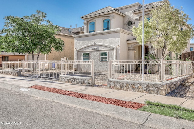 14376 N Cave Dr, El Paso, TX 79938 - mediterranean / spanish-style house with stucco siding and a fenced front yard