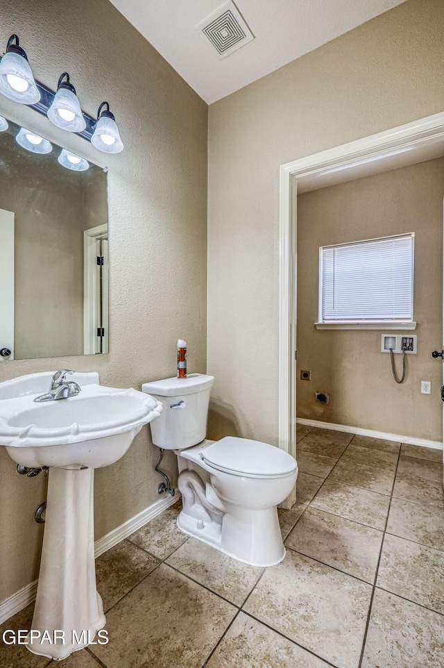 14376 N Cave Dr, El Paso, TX 79938 - half bath with tile patterned flooring and a textured wall