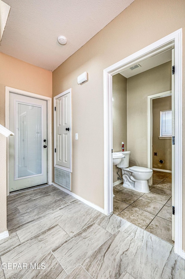 14376 N Cave Dr, El Paso, TX 79938 - bathroom with toilet and baseboards