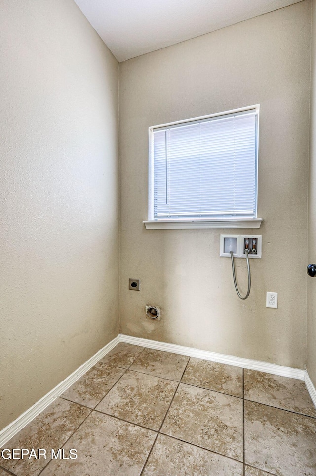 14376 N Cave Dr, El Paso, TX 79938 - laundry area featuring electric dryer hookup, hookup for a washing machine, and tile patterned flooring