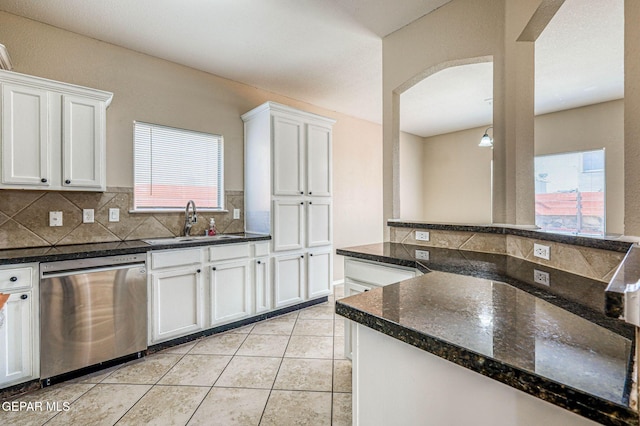 14376 N Cave Dr, El Paso, TX 79938 - kitchen featuring dishwasher, decorative backsplash, white cabinets, and arched walkways