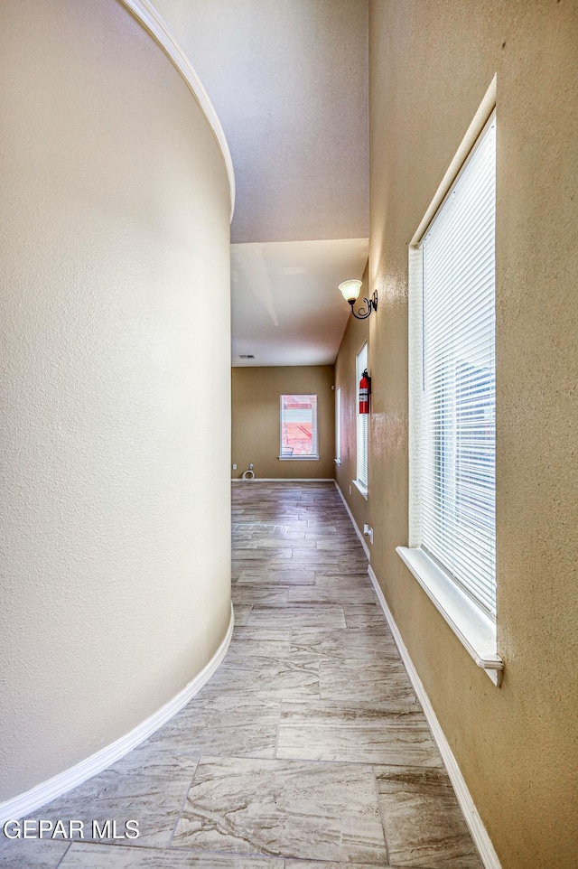 14376 N Cave Dr, El Paso, TX 79938 - corridor featuring a textured wall and wood finished floors
