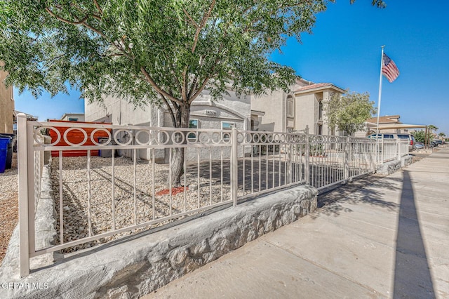 14376 N Cave Dr, El Paso, TX 79938 - view of front of house featuring stucco siding and a gate