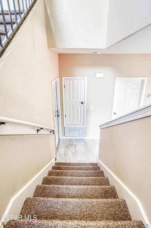 14376 N Cave Dr, El Paso, TX 79938 - stairway with baseboards