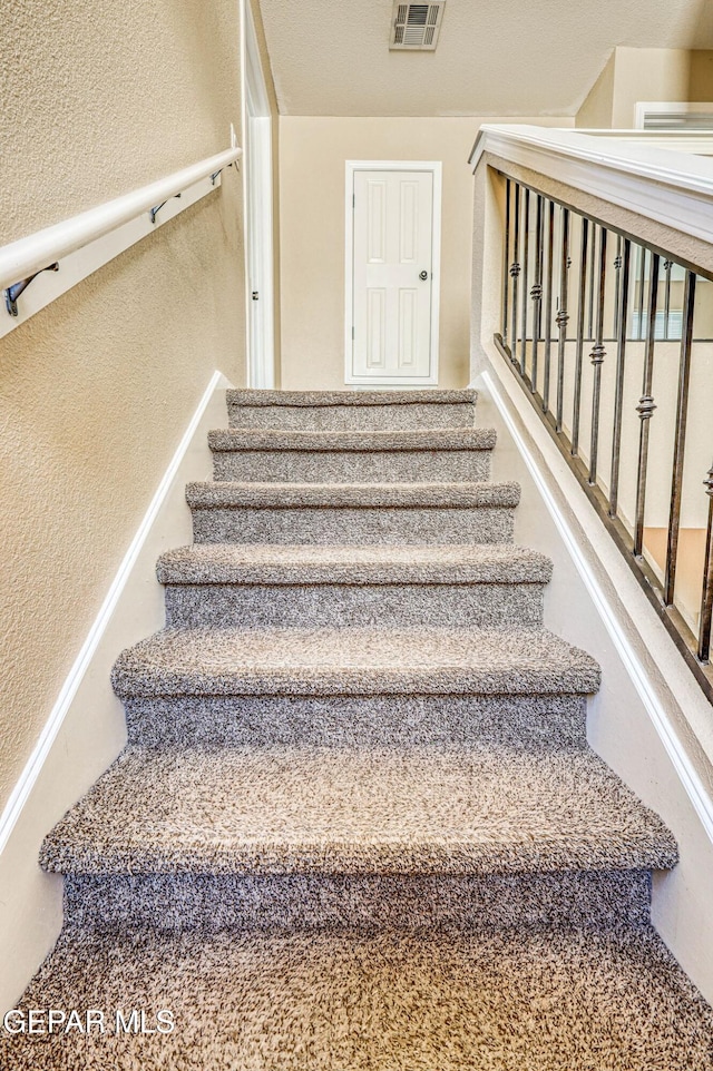 14376 N Cave Dr, El Paso, TX 79938 - stairs featuring a textured wall