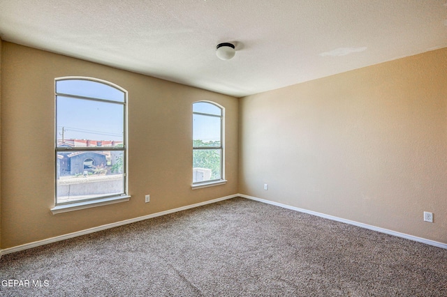 14376 N Cave Dr, El Paso, TX 79938 - spare room featuring carpet flooring and baseboards