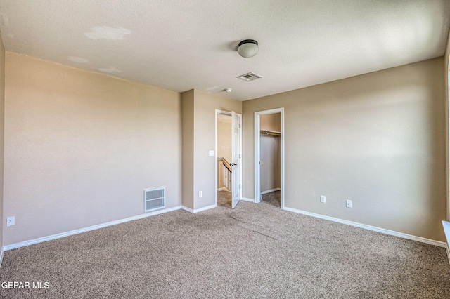 14376 N Cave Dr, El Paso, TX 79938 - unfurnished bedroom featuring carpet and a spacious closet