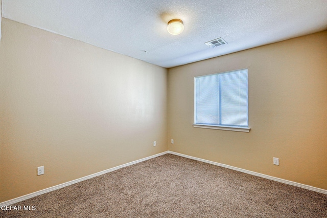 14376 N Cave Dr, El Paso, TX 79938 - carpeted spare room featuring baseboards and a textured ceiling