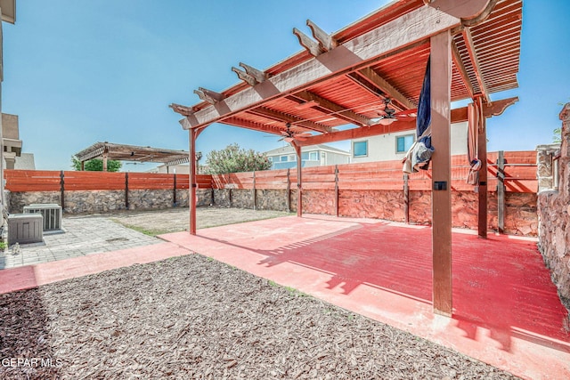 14376 N Cave Dr, El Paso, TX 79938 - fenced backyard featuring ceiling fan, a patio area, and a pergola