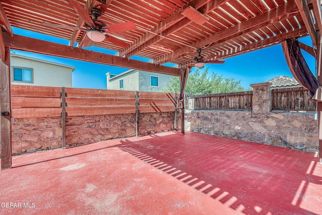14376 N Cave Dr, El Paso, TX 79938 - fenced backyard with a ceiling fan, a patio area, and a pergola