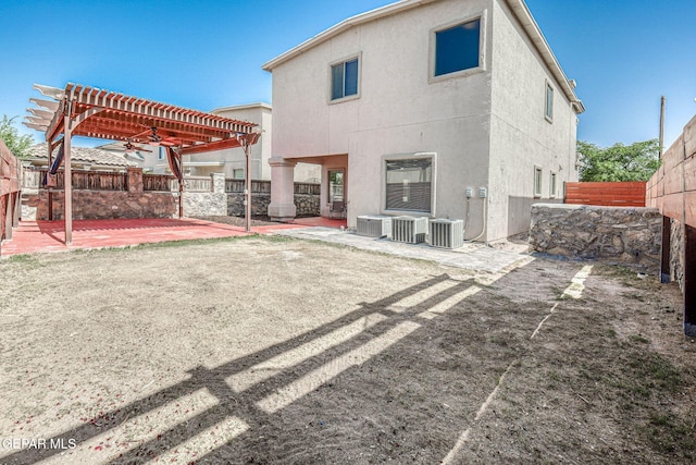 14376 N Cave Dr, El Paso, TX 79938 - back of house with a patio, a pergola, a fenced backyard, a ceiling fan, and stucco siding