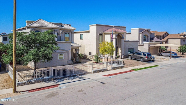 14376 N Cave Dr, El Paso, TX 79938 - view of front of property featuring a fenced front yard, stucco siding, and a tiled roof