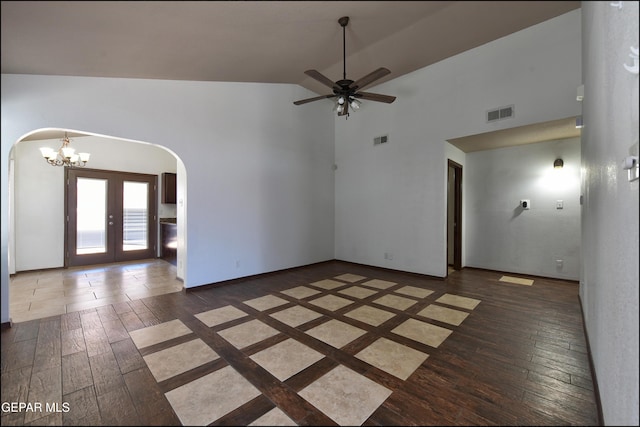 4908 Gold Ranch Ave, El Paso, TX 79934 - spare room featuring arched walkways, wood-type flooring, a chandelier, high vaulted ceiling, and a ceiling fan