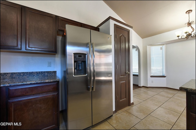 4908 Gold Ranch Ave, El Paso, TX 79934 - kitchen with stainless steel fridge with ice dispenser, vaulted ceiling, dark brown cabinets, a chandelier, and light tile patterned flooring