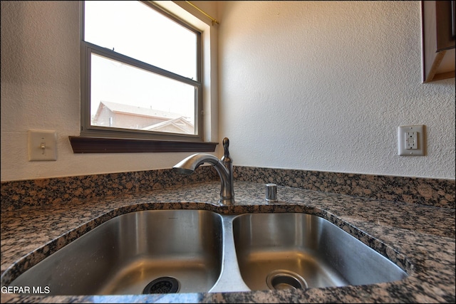 4908 Gold Ranch Ave, El Paso, TX 79934 - kitchen view of a sink and dark stone counters