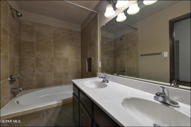 4908 Gold Ranch Ave, El Paso, TX 79934 - bathroom with tiled shower / bath combo, double vanity, and a chandelier