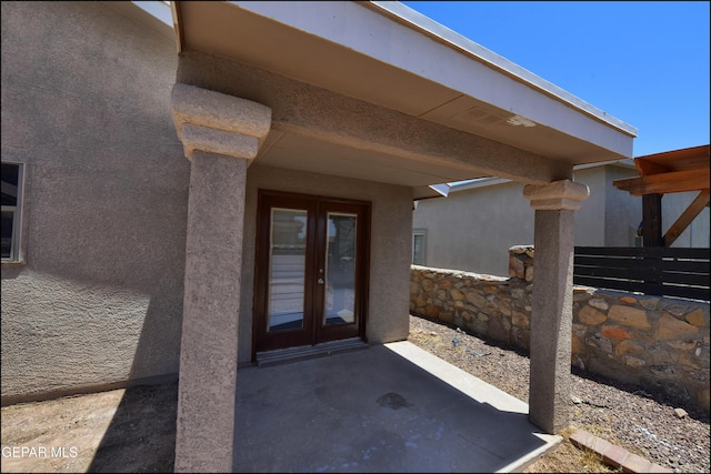 4908 Gold Ranch Ave, El Paso, TX 79934 - doorway to property featuring french doors, stucco siding, and a patio